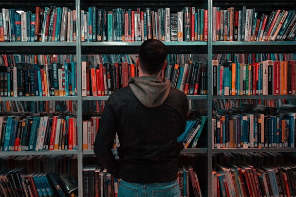 Man browsing in library