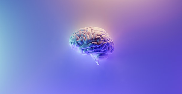 Computer generated image of human brain on purple background