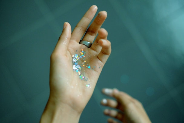 Hand holding glitter