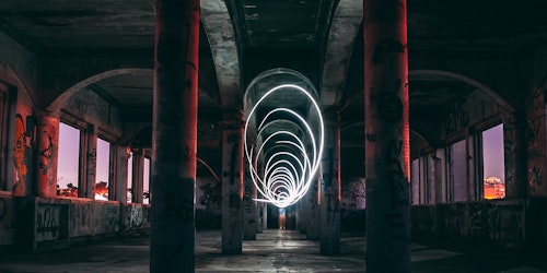 Light shutter effects inside dark graffiti'd tunnel