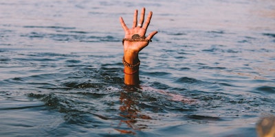 Hand emerging from water