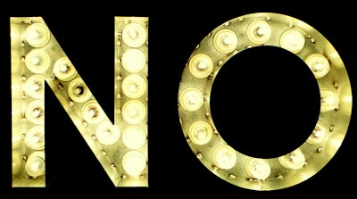 Yellow lightbulbs spell out the word 'no' against a black background