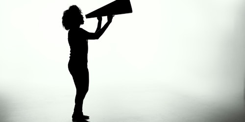 A silhouette of a young person holding a megaphone against a white background