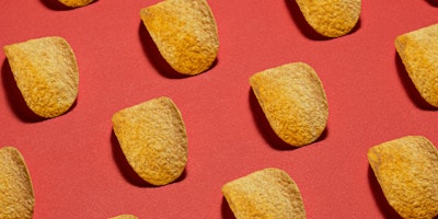 Pringles displayed neatly against a red background