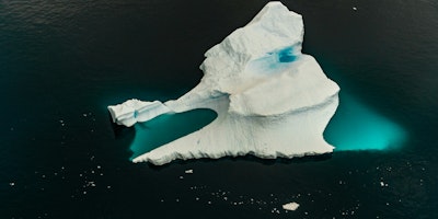 The tip of an iceberg in a sea of water
