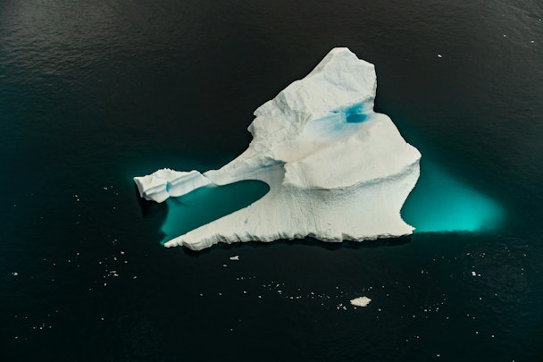 The tip of an iceberg in a sea of water