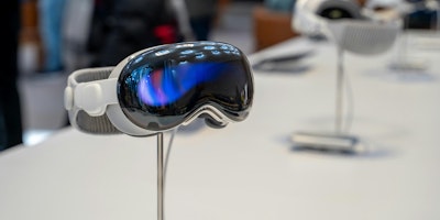 An Apple Vision Pro headset on display in a store