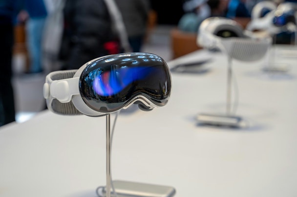 An Apple Vision Pro headset on display in a store