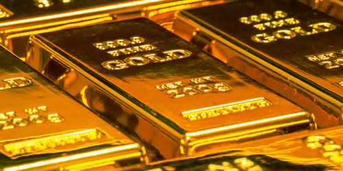 Hallmarks on glistening gold bars