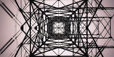 A pylon viewed from below making an abstract pattern