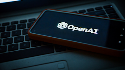 OpenAI logo on mobile screen
