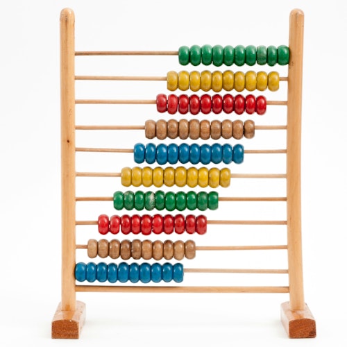 A multicolored wooden abacus against a white background