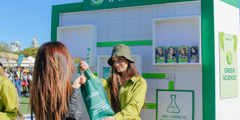 Garnier hands out products at a festival 