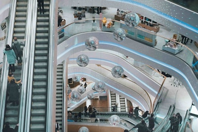Escalators and mirror balls in the atrium of a shopping mall 