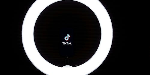 A light ring frames the TikTok logo A light ring frames the TikTok logo