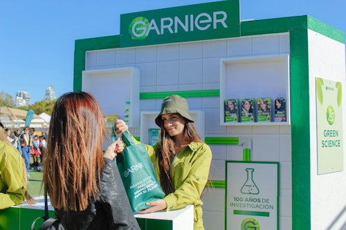 Garnier hands out products at a festival 