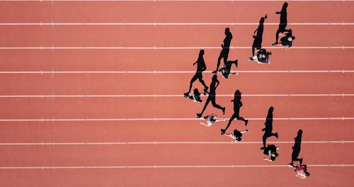 Runners on a track, in an arrow formation