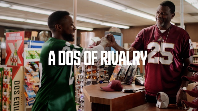 Two men in convenience store wearing football jerseys