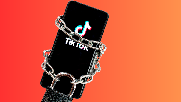 TikTok app on phone in chains and lock