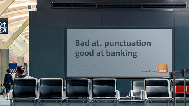 billboard that says "bad at punctuation, good at banking"