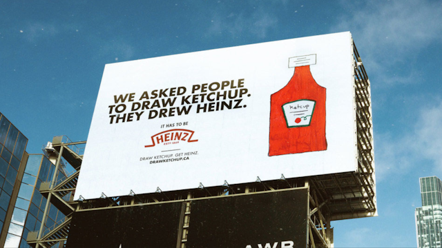 billboard with a drawing of a bottle of ketchup