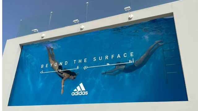 billboard with two divers in a swimming pool
