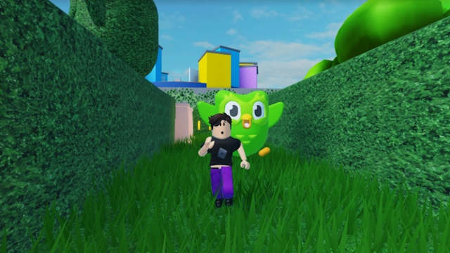 roblox's duolingo game shows an avatar running away from its owl mascot, duo