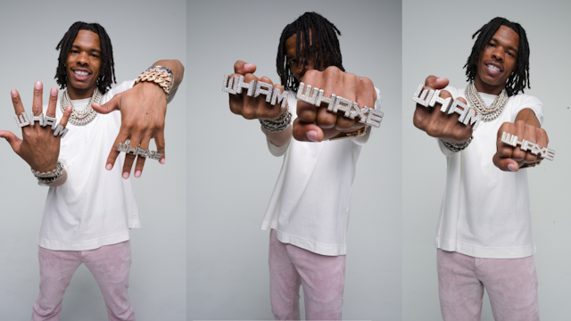 lil baby poses with the "WHAXE" ring